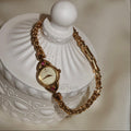 Vintage Seiko 1E20-0430 Ruby Accent Gold Bracelet Watch — Circa 1986